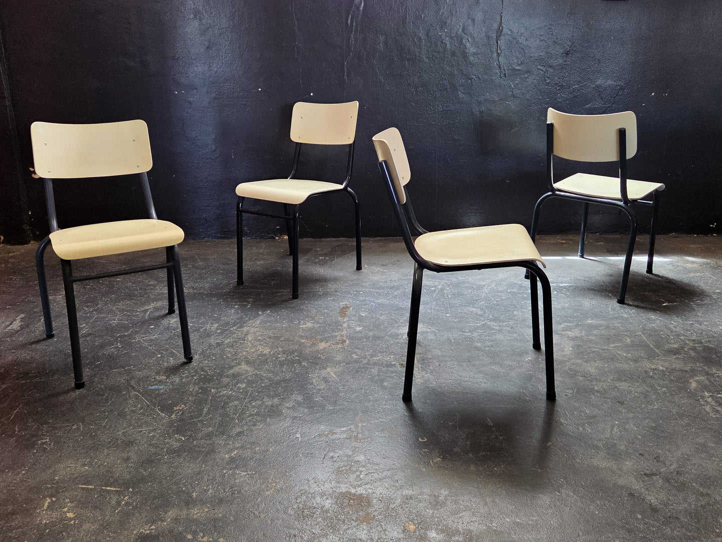 Four Cream and Black Chappie Chairs