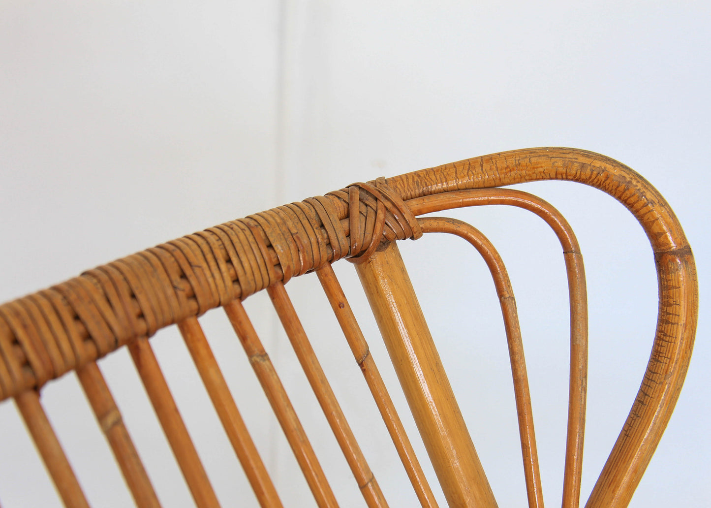 A Pair of Wingback Cane Armchairs