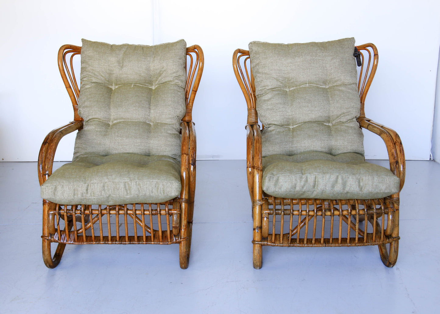 A Pair of Wingback Cane Armchairs