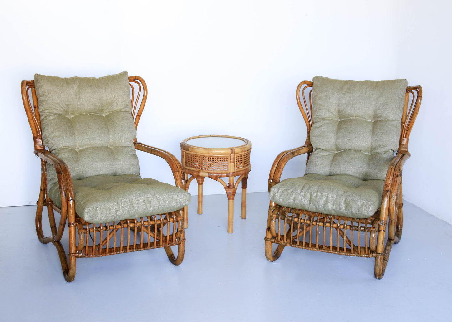 A Pair of Wingback Cane Armchairs