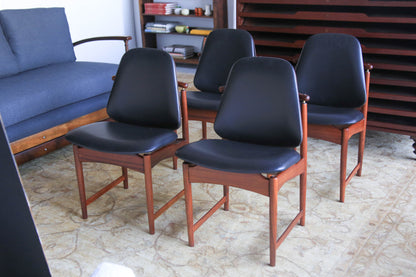A Set of Four Frystark Status Dining Chairs