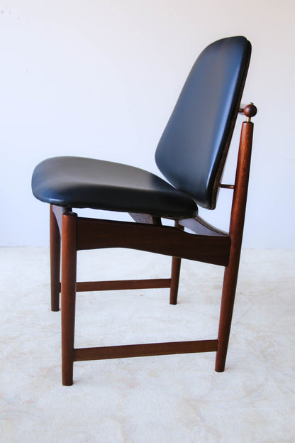 A Set of Four Frystark Status Dining Chairs