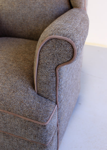 A Pair of Vintage Wingback Rocking Chairs