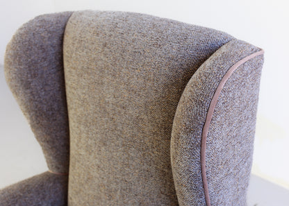 A Pair of Vintage Wingback Rocking Chairs