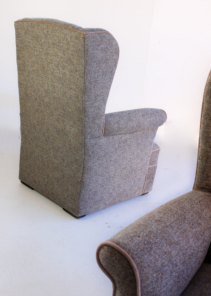 A Pair of Vintage Wingback Rocking Chairs