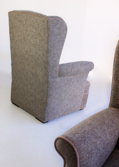 A Pair of Vintage Wingback Rocking Chairs