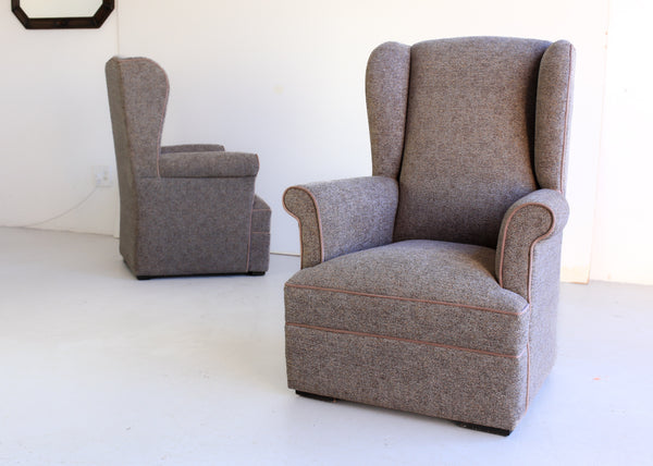 A Pair of Vintage Wingback Rocking Chairs