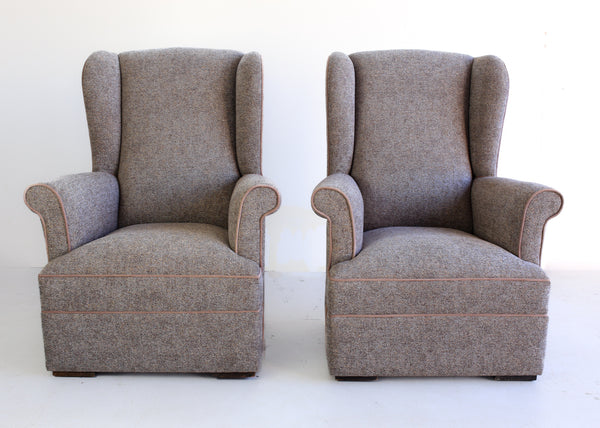 A Pair of Vintage Wingback Rocking Chairs