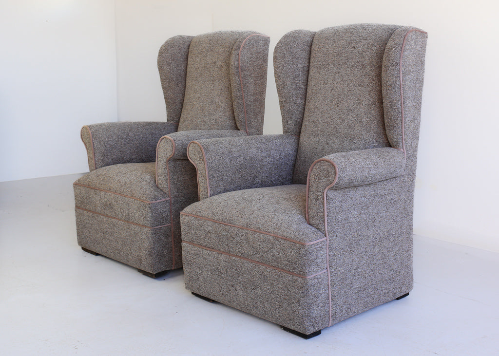 A Pair of Vintage Wingback Rocking Chairs