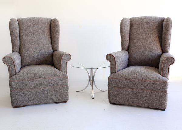 A Pair of Vintage Wingback Rocking Chairs