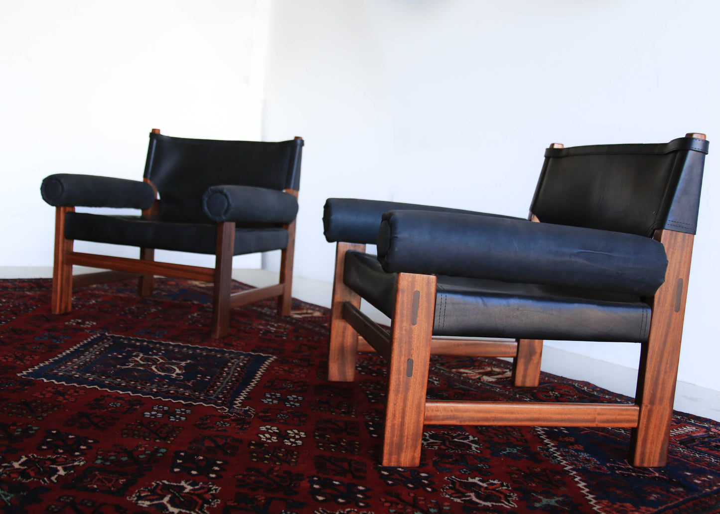 A Pair of Safari Model Leather and Mahogany Armchairs, by John Tabraham for Kallenbach's