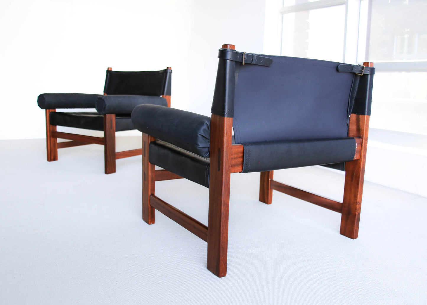A Pair of Safari Model Leather and Mahogany Armchairs, by John Tabraham for Kallenbach's