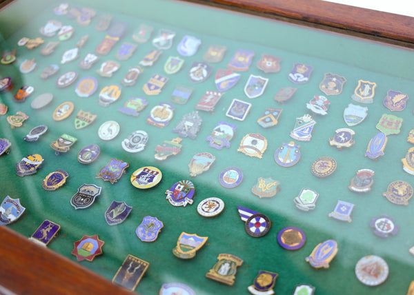 Display Cabinet with Vintage Enamel Bowling Badges