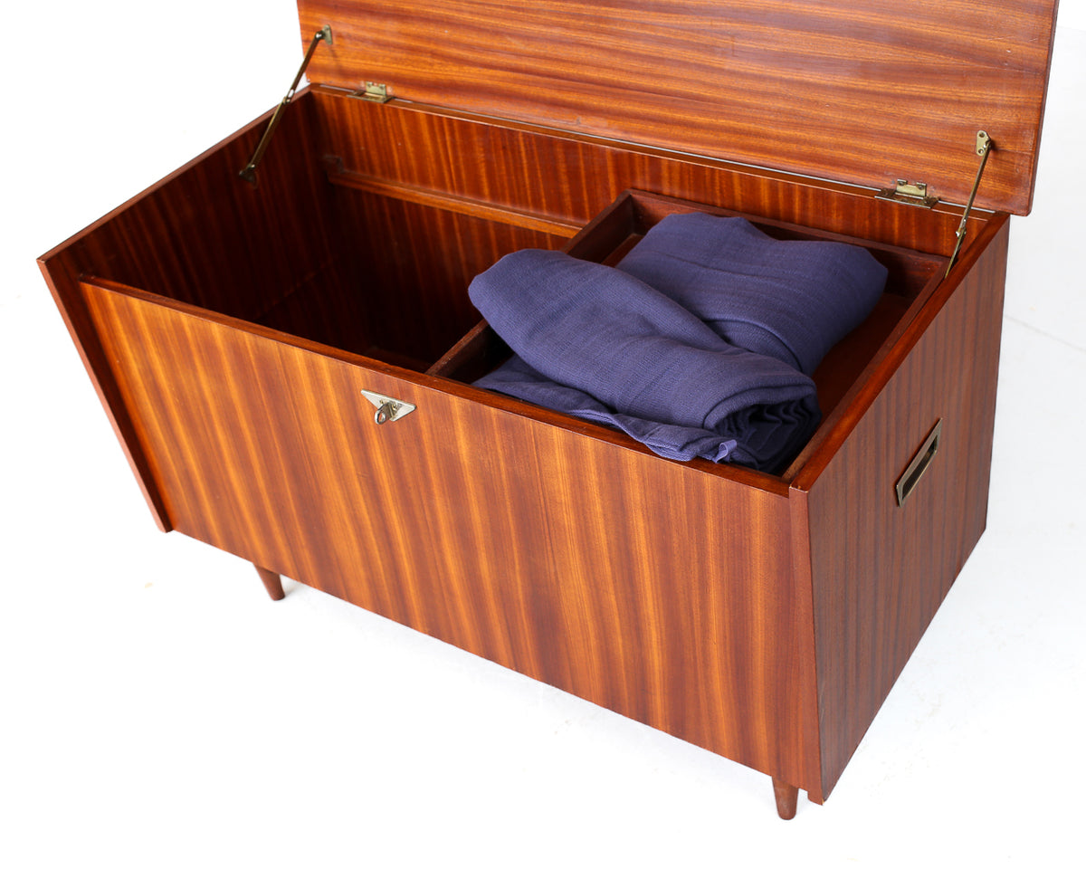 Mid-Century Kist with Tapered Legs and Shaped Top