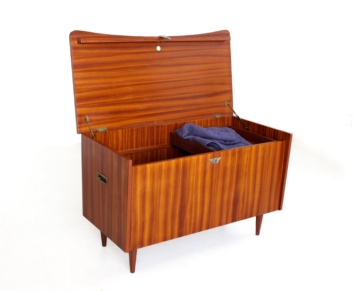 Mid-Century Kist with Tapered Legs and Shaped Top