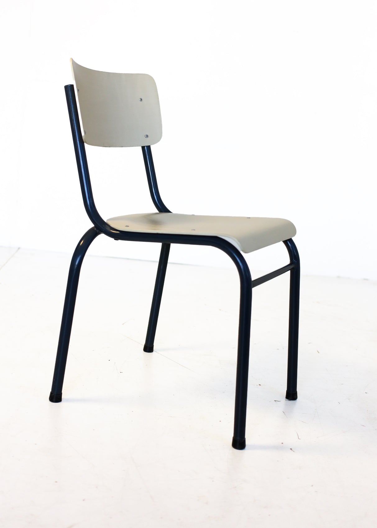 Four Cream and Black Chappie Chairs