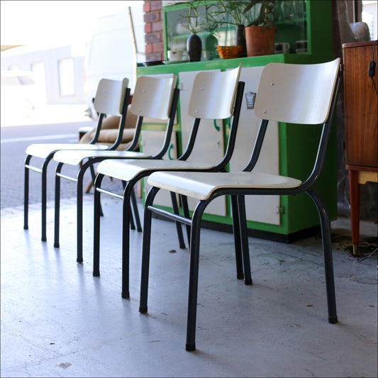 Four Cream and Black Chappie Chairs