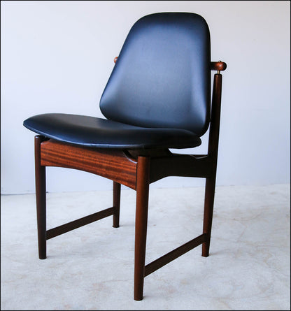 A Set of Four Frystark Status Dining Chairs