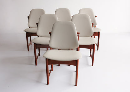 A Set of Six Frystark Status Dining Chairs